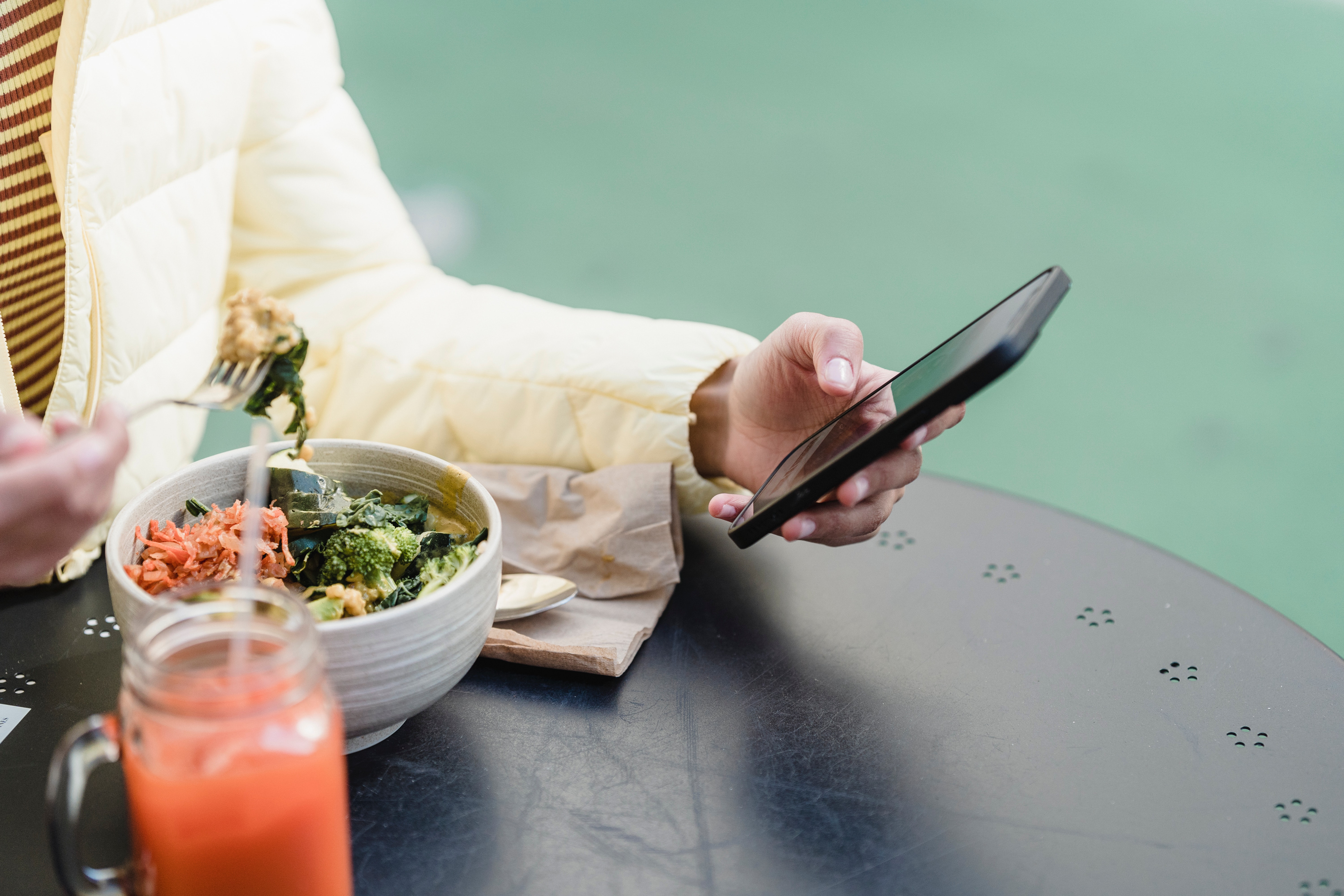 Employee accessing wellness benefits on their phone for National Wellness Month