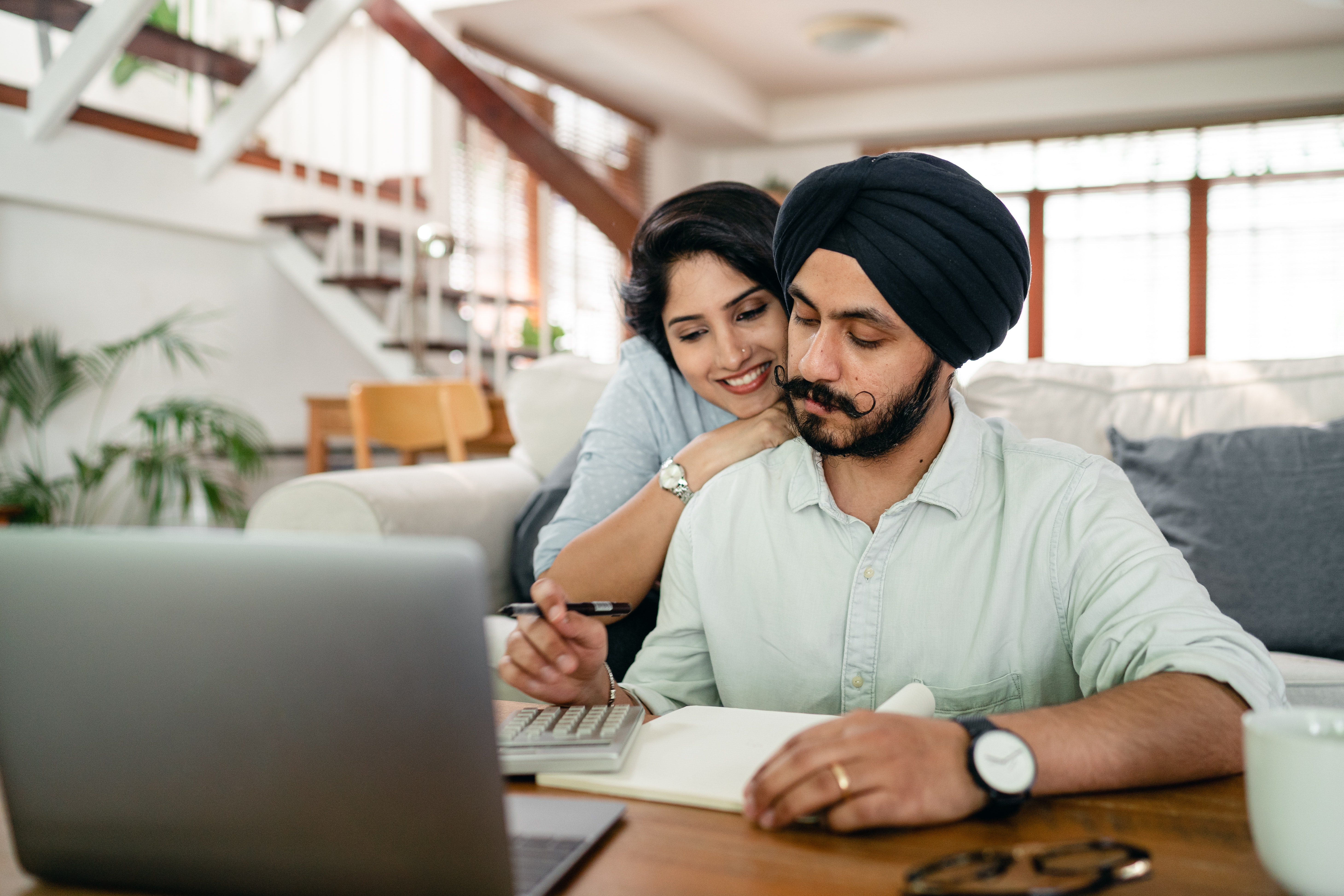 A young couple discusses their financial wellbeing using the LearnLux program