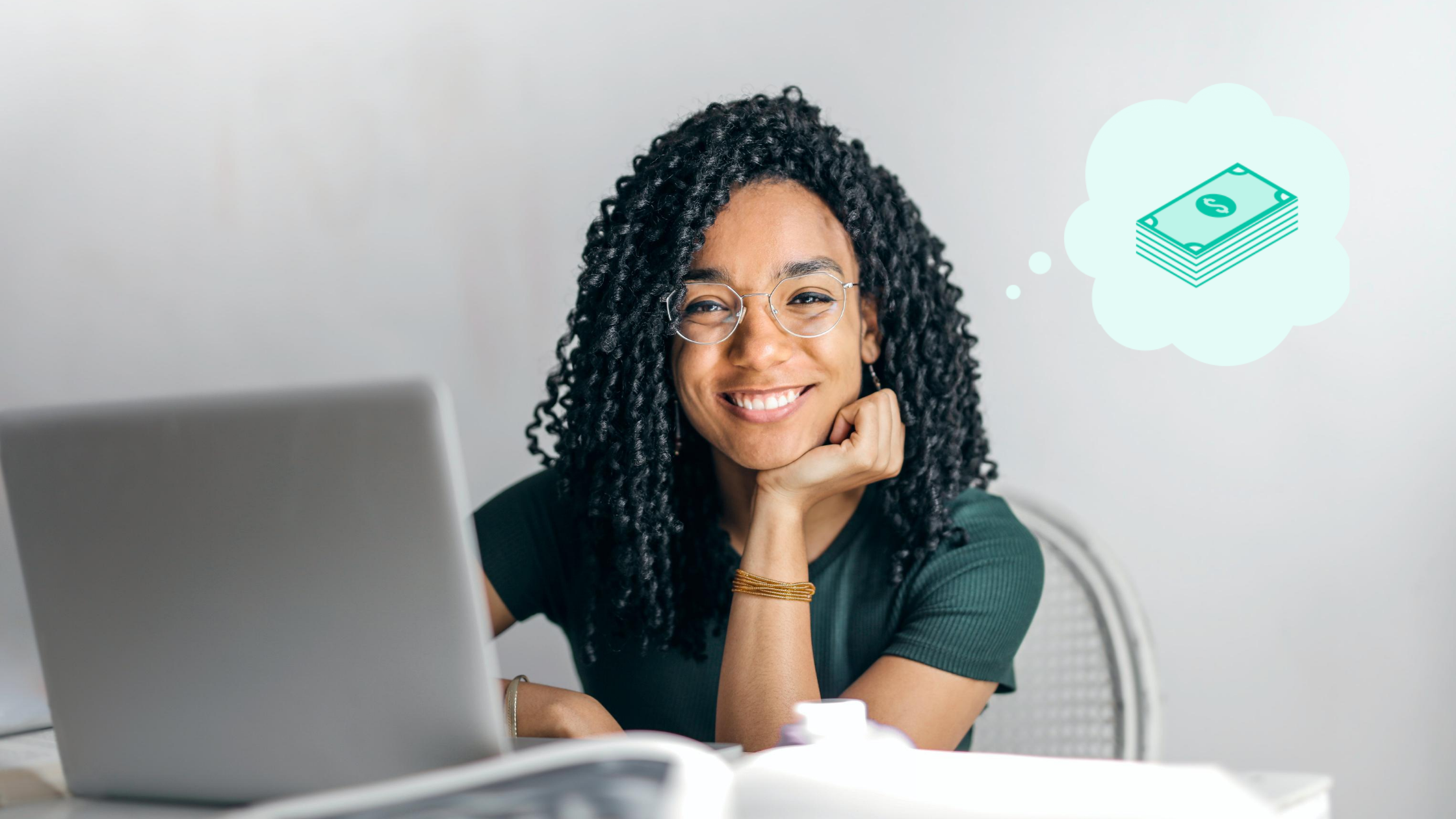 Black female employee with green shirt thinking about financial wellbeing